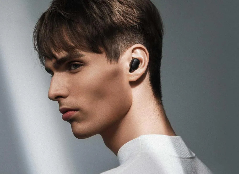 Redmi AirDots black true wireless earbuds with charging case.