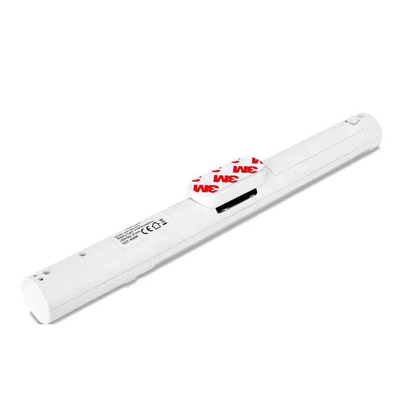 Slim white human body induction LED wall light with magnet back for under-cabinet or wardrobe installation.