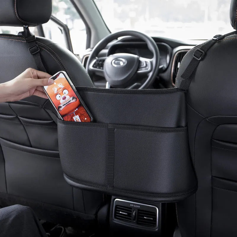 Black genuine leather car seat storage organiser with carbon fibre pattern measuring 38x24x15cm