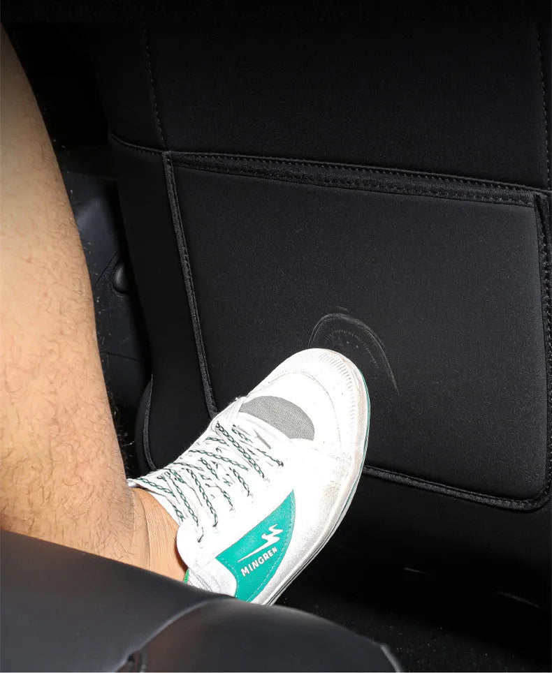 Black leather rear anti kick pad for car seat, shown with a single storage pocket.