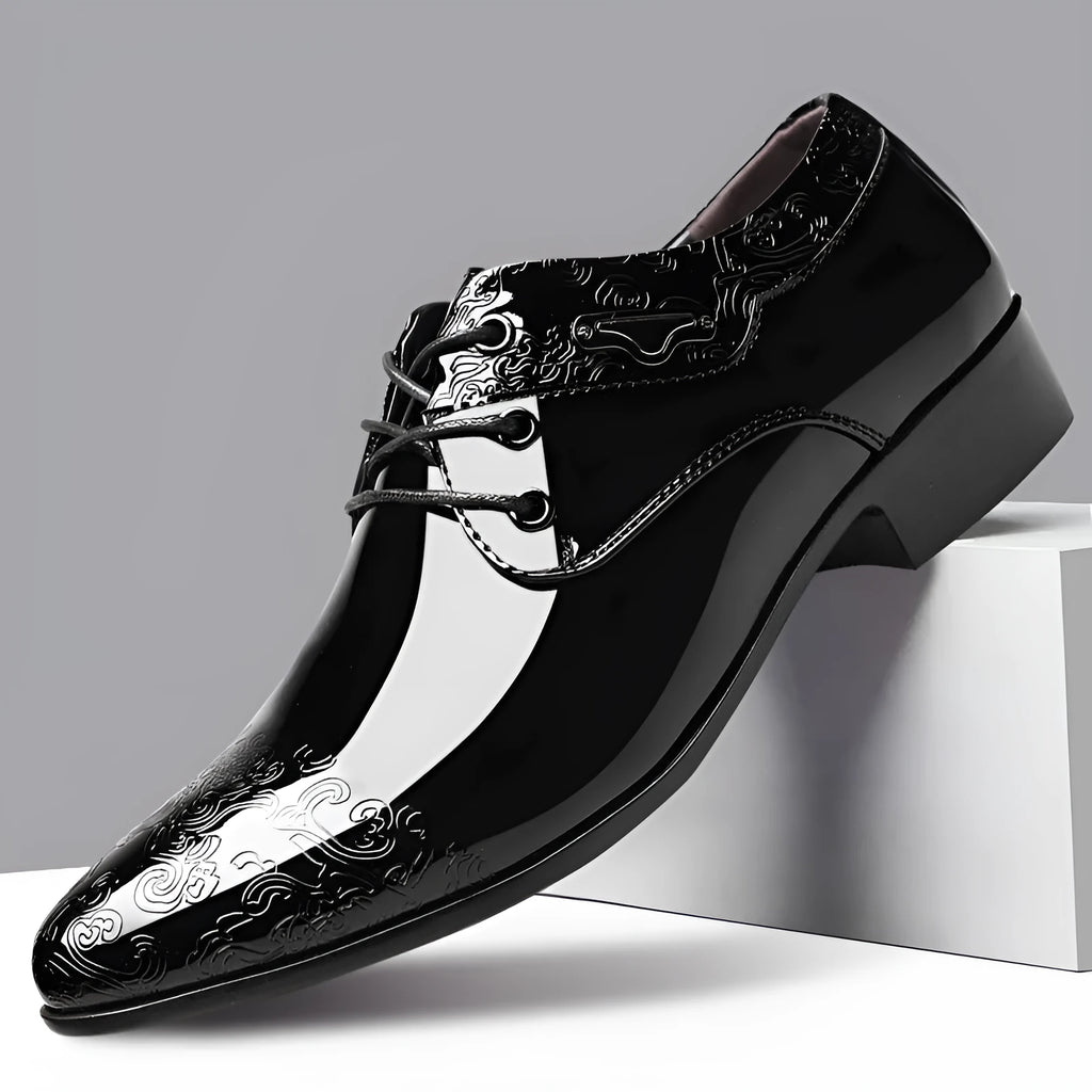Men's glossy black patent leather formal shoes with pointed toe and carved detail, low top style