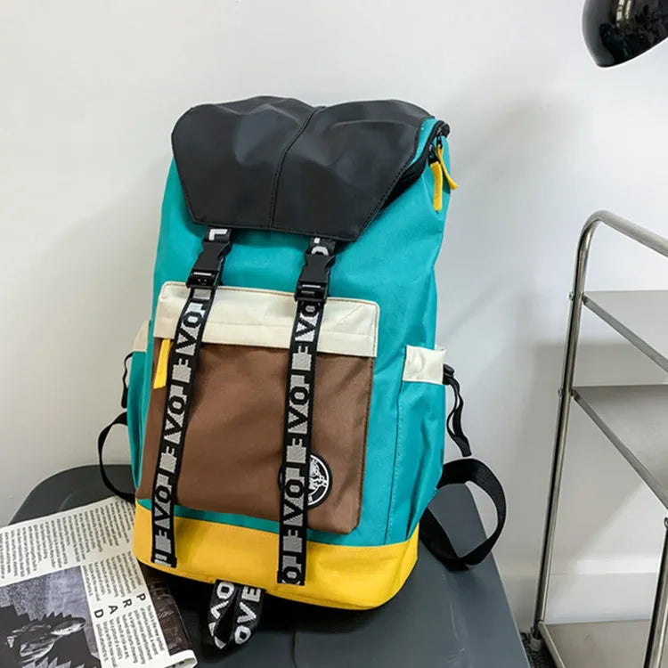 Oxford cloth student backpack shown in black, green, or red with multiple carry straps.