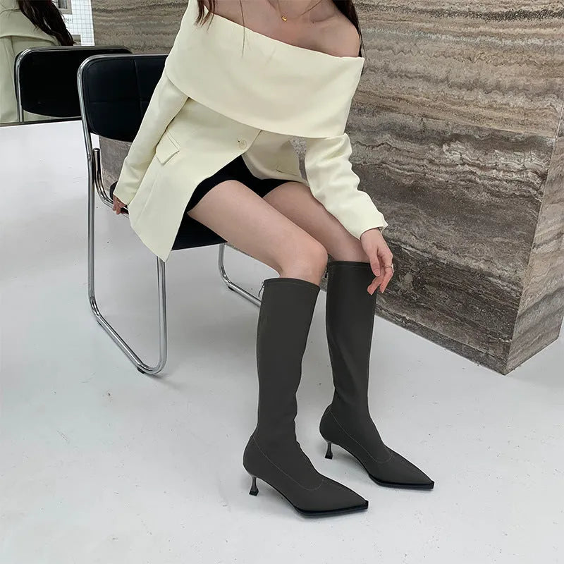 Women's black pointed toe ankle boots with stiletto heel and back zip fastener