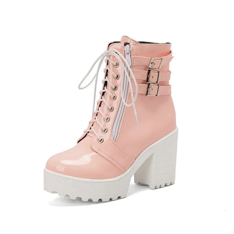 Women's black thick-heeled short boots with lace-up front and round toe on a waterproof platform.