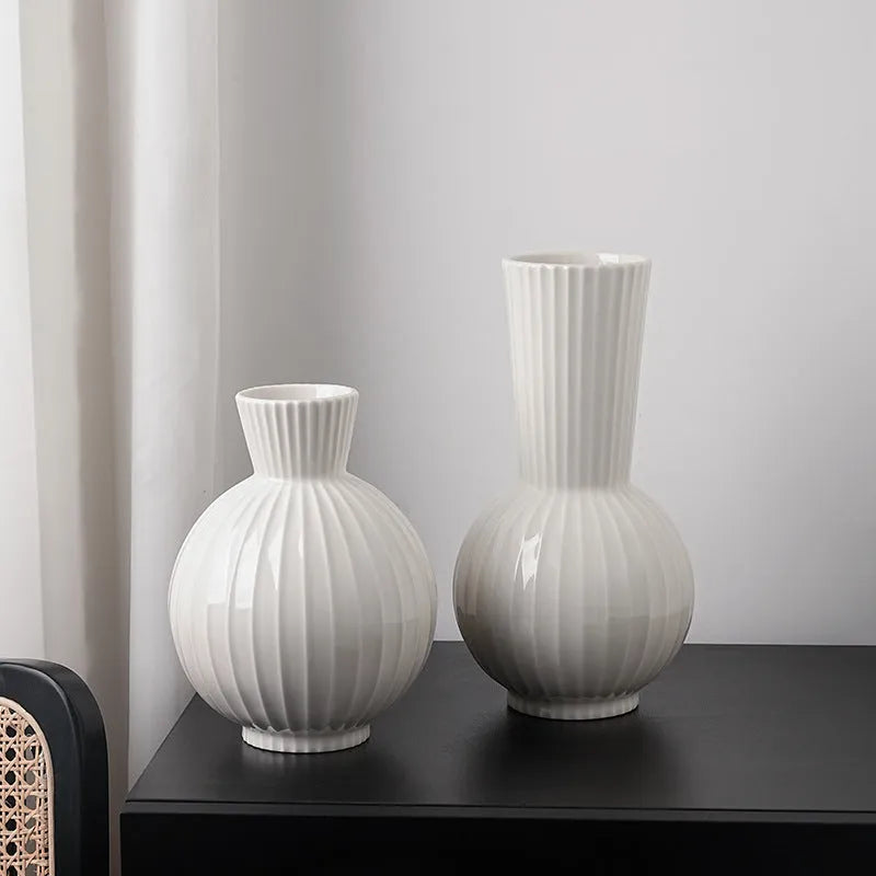 American country style ceramic vase with white base and blue stripes on living room table