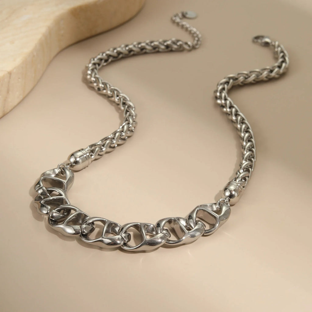 Stainless steel geometric pendant necklace with 18K gold plating in gold and steel colour options.