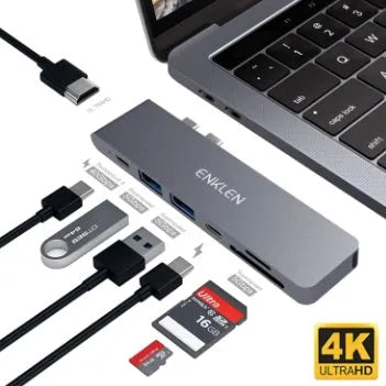 Silver aluminium 7-in-1 USB-C hub adapter with SD card slot, HDMI, USB 3.0, and charging ports.