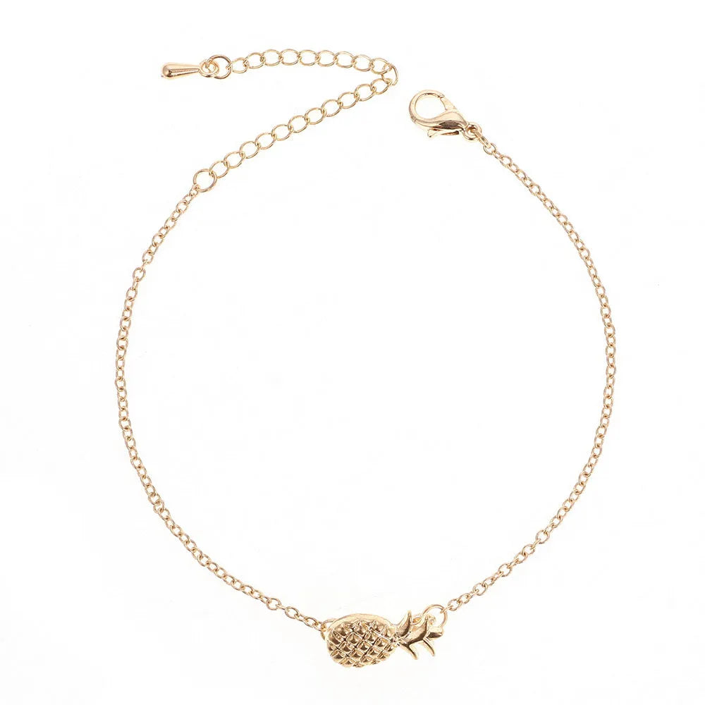 Women's gold or silver tone alloy bracelet with a pineapple charm.