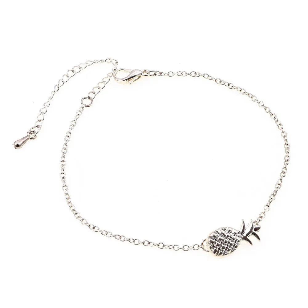 Women's gold or silver tone alloy bracelet with a pineapple charm.