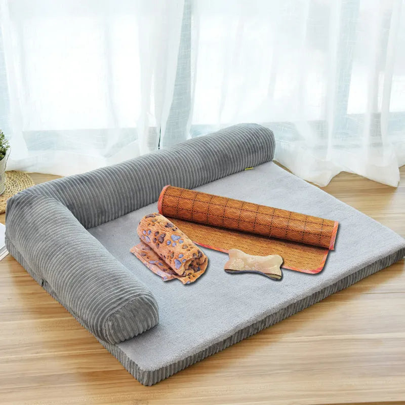 Corduroy pet sofa dog bed in grey, showing removable cover and non-slip base, placed on a hardwood floor.