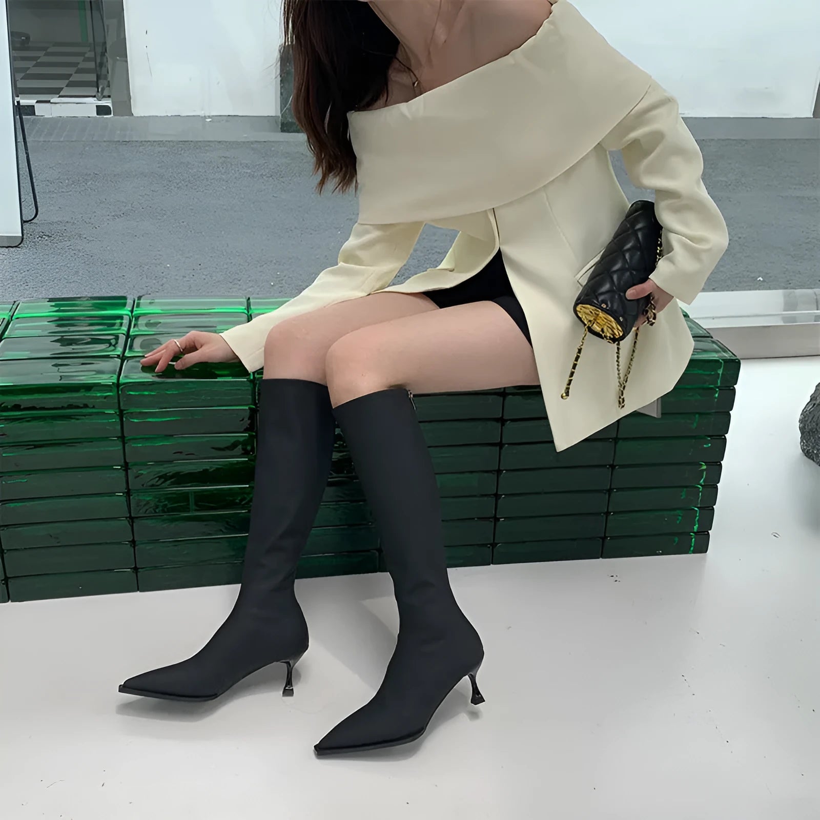 Women's black pointed toe ankle boots with stiletto heel and back zip fastener