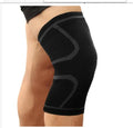A pair of black double corrugated non-slip stretch sports kneecaps for knee protection.