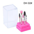 Set of seven tungsten steel nail drill polishing heads and brush in a transparent storage case.