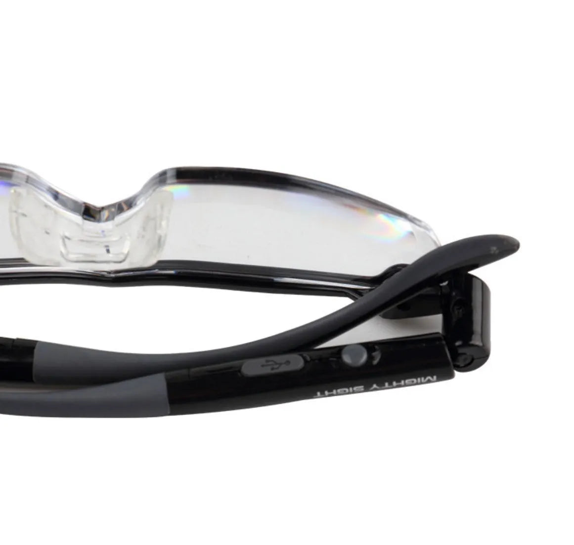 Transparent black USB LED reading glasses with illuminated frame on a desk