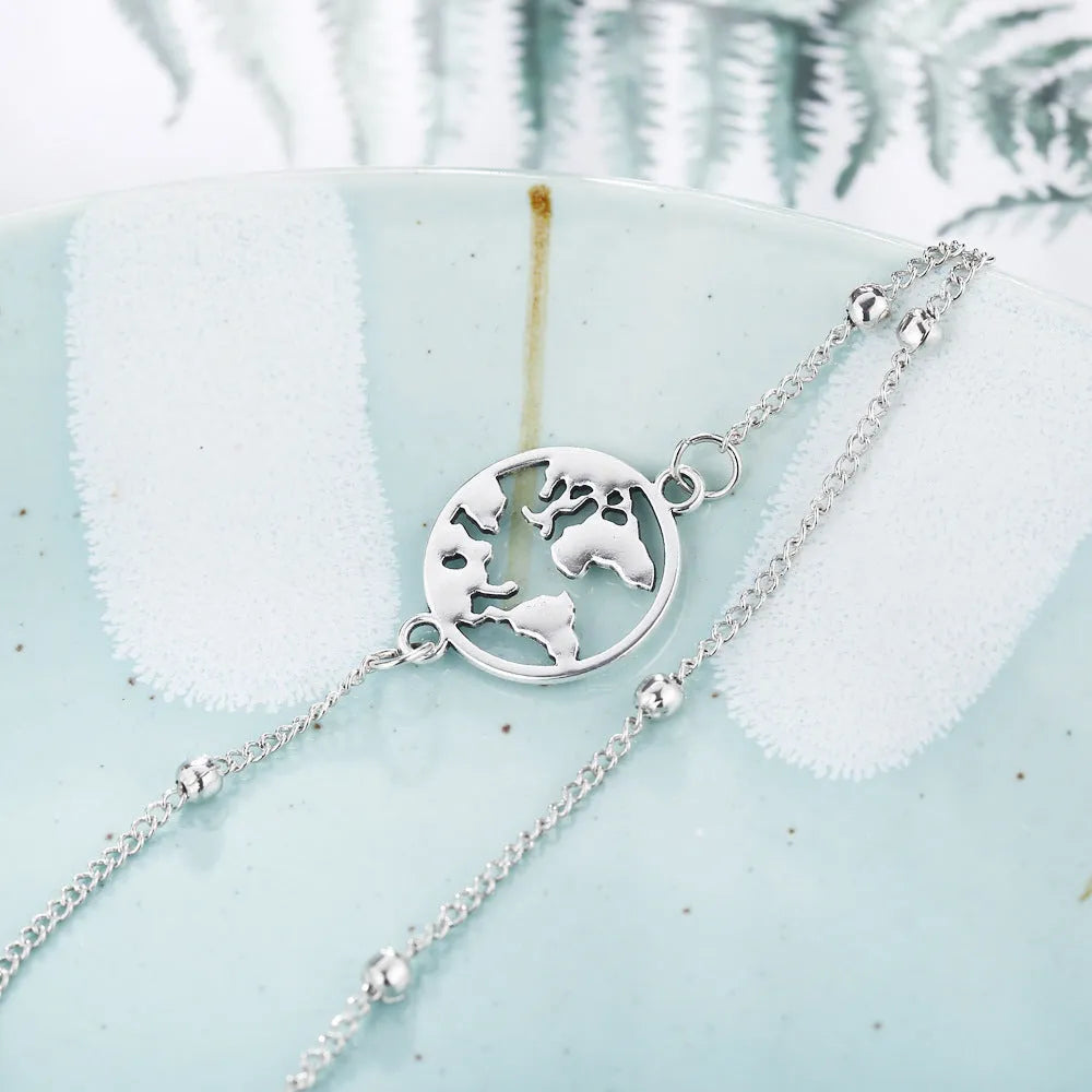 Three-piece anklet set with love heart, map, and eight character charms in simple style, photo colour