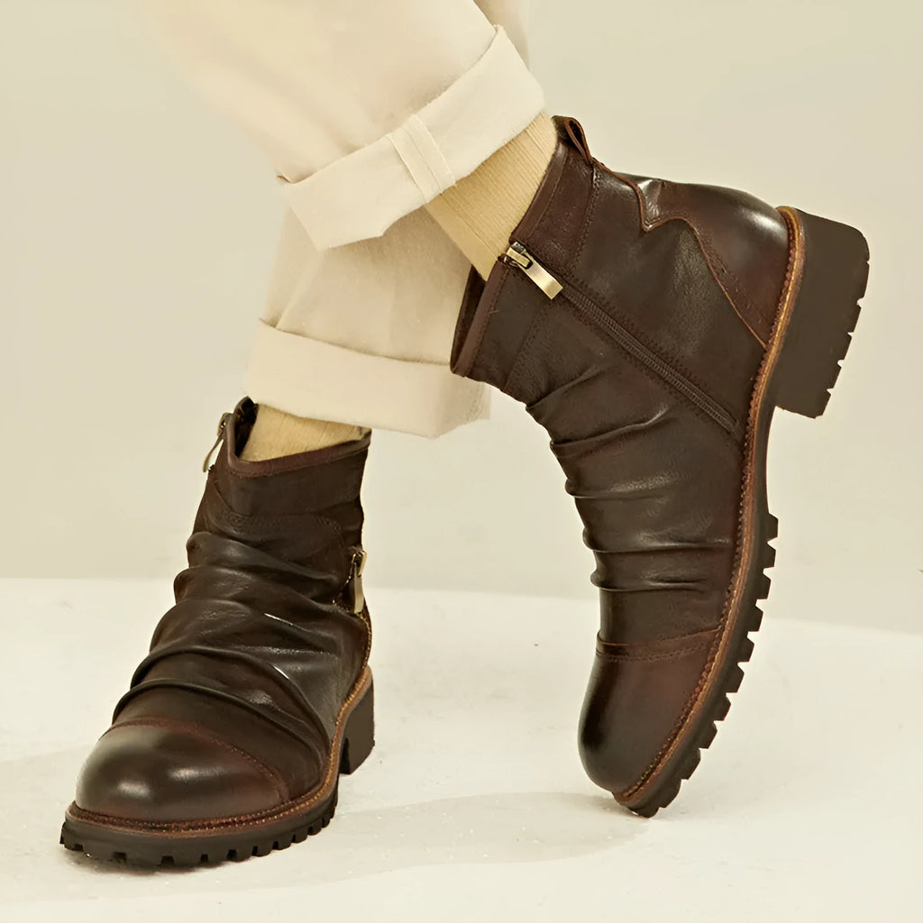 Mid-height black cowboy boots with side zipper, round toe, and horseshoe rubber heel