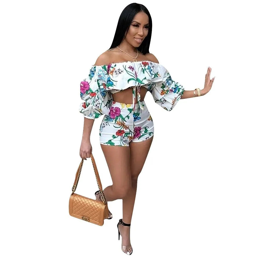 Multicolour digital print two-piece costume with fluffy sleeves and matching shorts.
