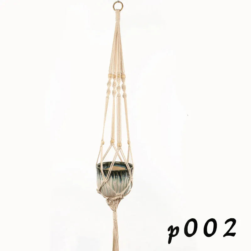Woven wire basket with cotton rope, styled as a rustic desktop or wall-hanging planter for houseplants.