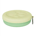 Collapsible silicone dog bowl shown in expanded feeding position and folded flat storage position