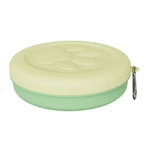 Collapsible silicone dog bowl shown in expanded feeding position and folded flat storage position