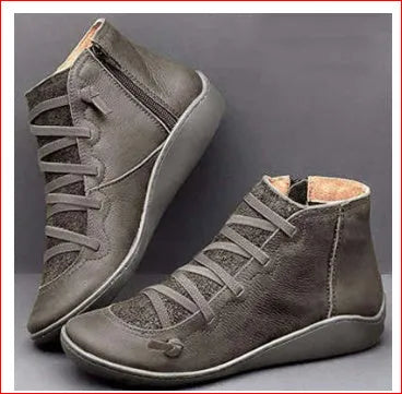 Women's round-toe casual booties with a wedge heel in artificial PU, shown in multiple colours.