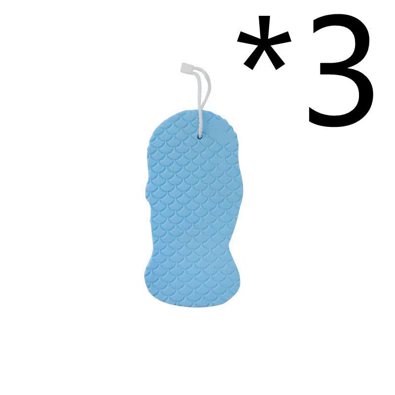 3D fish scale pattern bath sponge ball in assorted colours on a bathroom background.