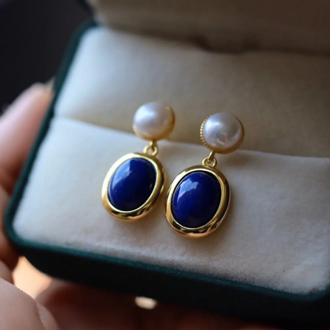 A pair of simple lapis lazuli pearl dangle earrings in 925 sterling silver with auspicious patterns.