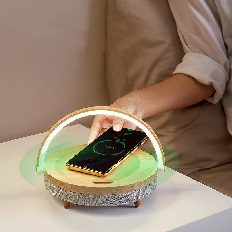 Wireless charging LED night light with Bluetooth speaker showing marble pattern finish and phone holder