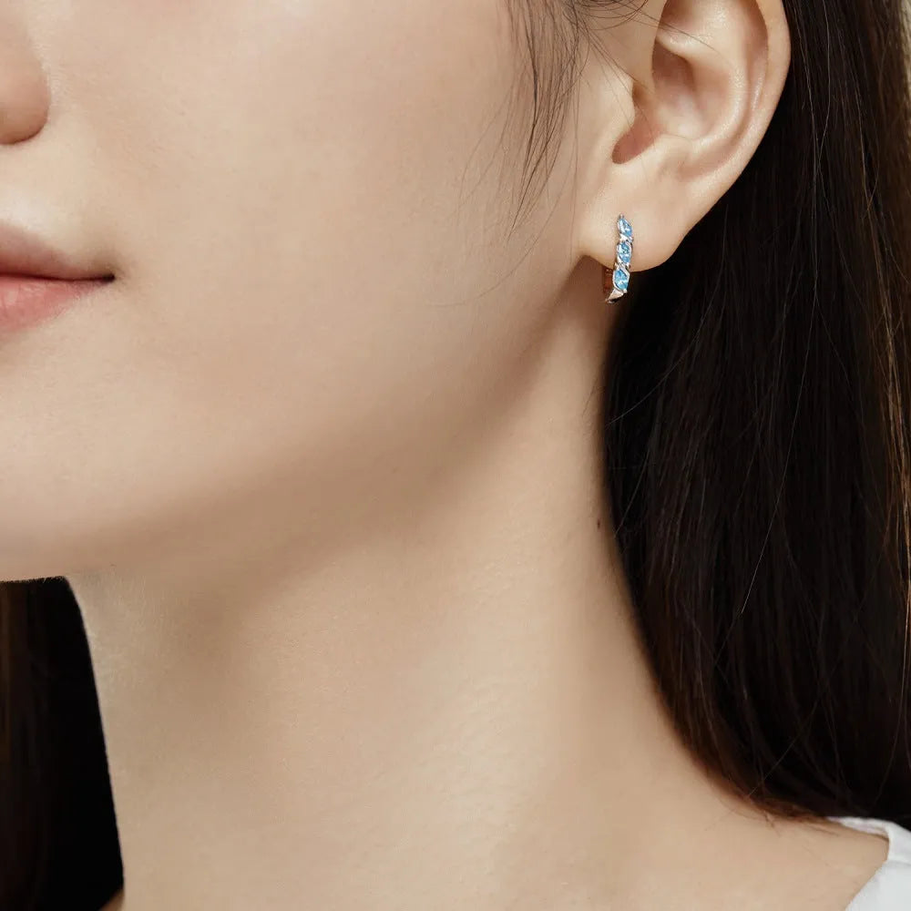 925 silver women's earrings with blue zircon inlay and platinum blue diamond electroplated finish in compact 3x14x15mm size.