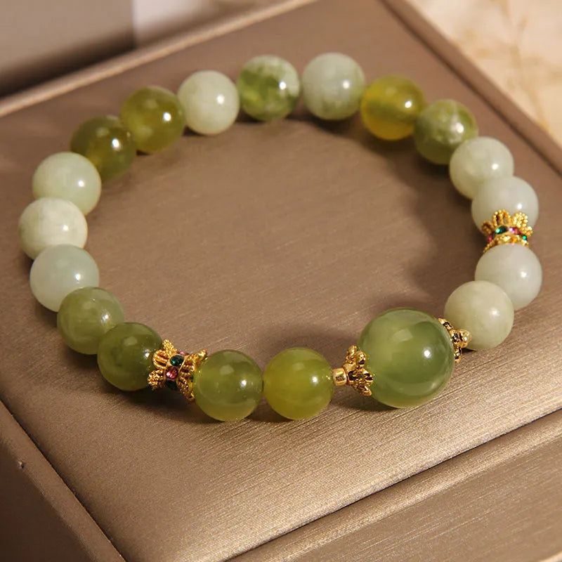 Women's bracelet made of green Xiuyan jade with an original sweet Mori style design.