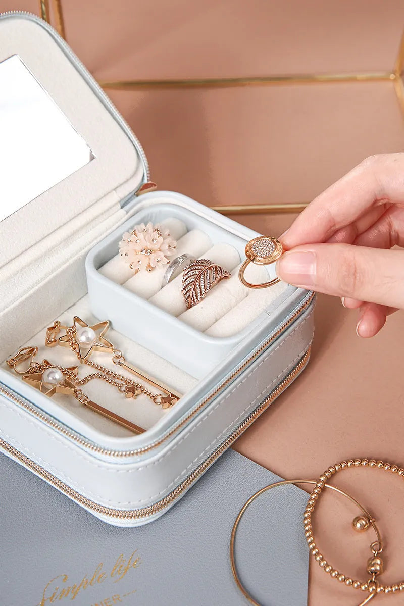 Portable double-sided travel jewellery box in blue with PU leather exterior and pearl velvet lining