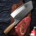 Stainless steel kitchen knife with a 320mm blade on a cutting board.
