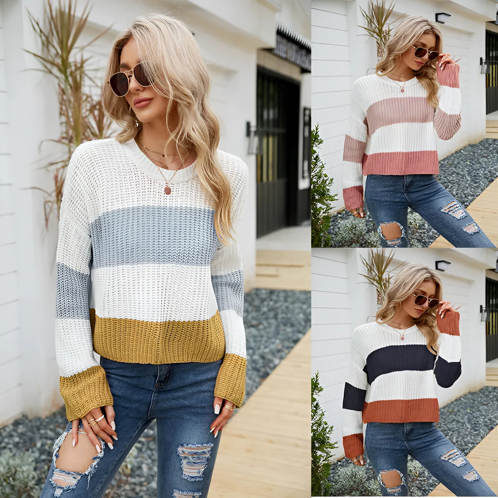 Women's short-length loose striped acrylic pullover sweater on a hanger.