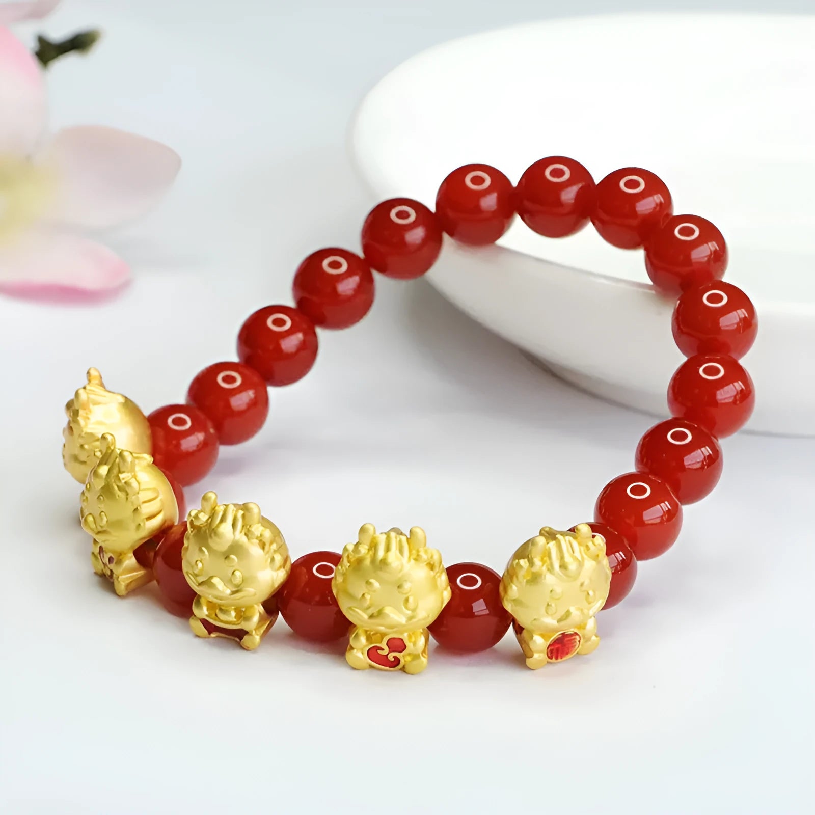 Natural red agate bracelet with five blessing dragon design on 8mm beads.