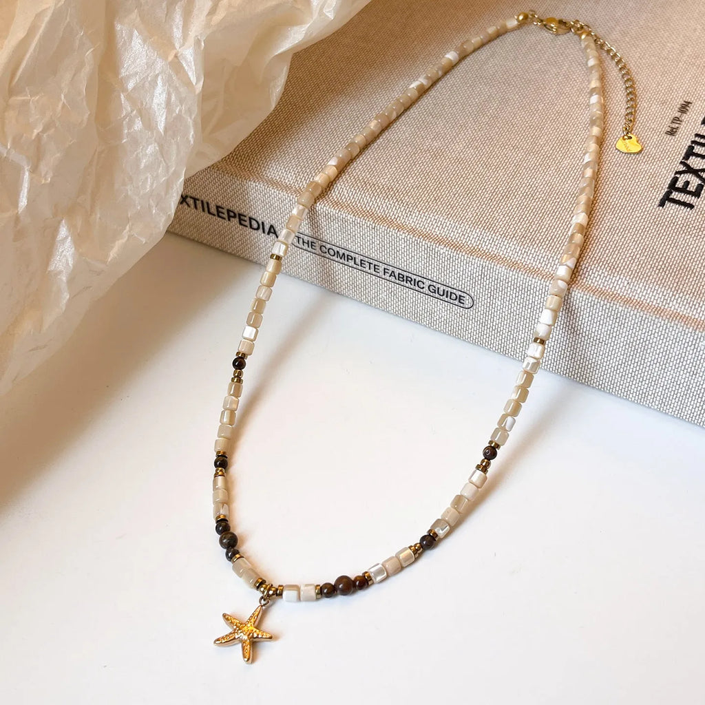 Titanium steel starfish pendant necklace with natural shell and tigereye beads on a Maillard style chain