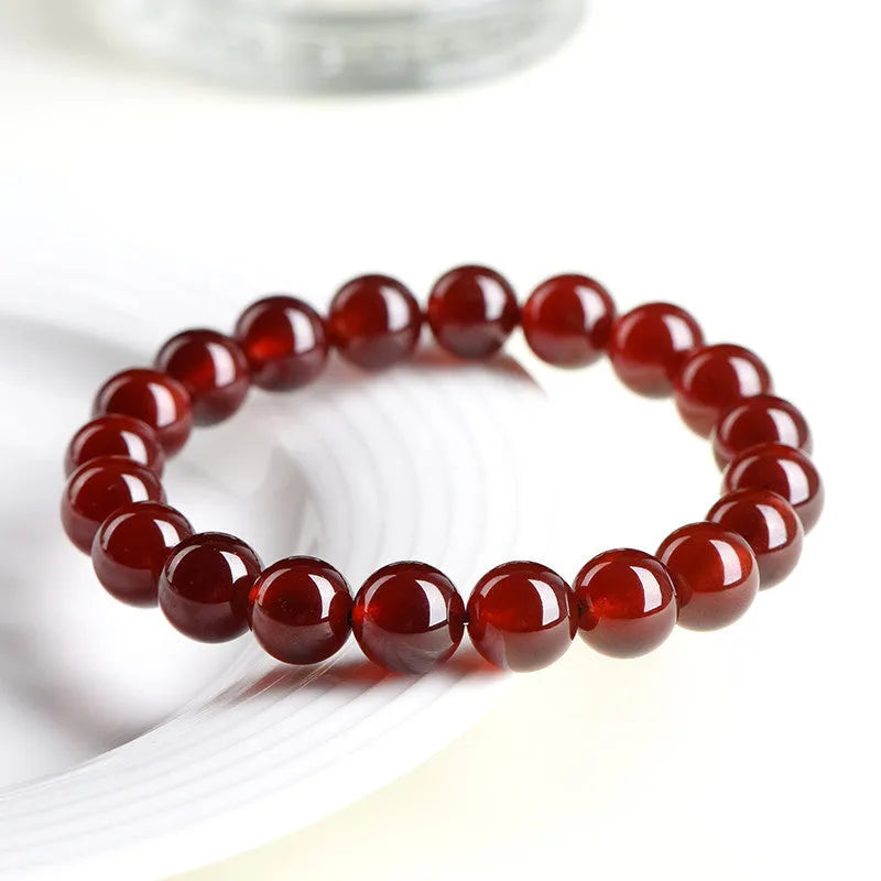 Natural orange red garnet crystal bracelet with Ruyi design elements in retro style