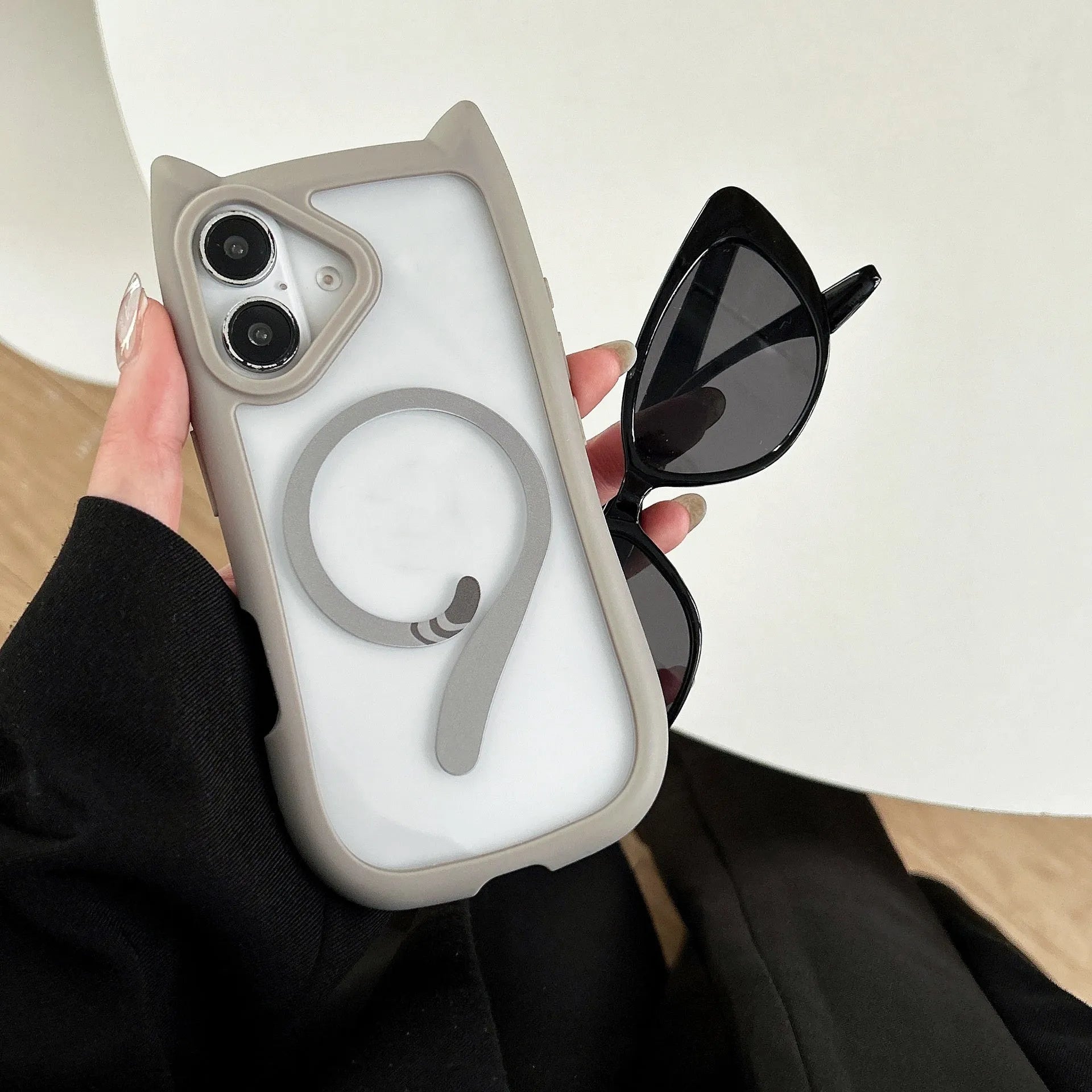 Transparent acrylic TPU phone case showing magnetic elements and wave pattern design for iPhone 17