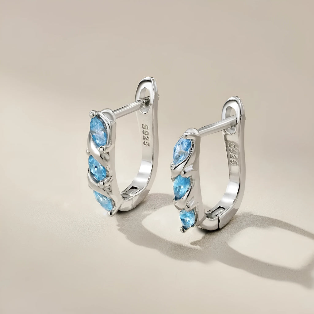 925 silver women's earrings with blue zircon inlay and platinum blue diamond electroplated finish in compact 3x14x15mm size.