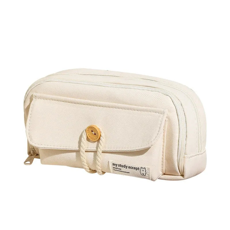 Korean style canvas pencil case in beige, blue, grey, or green holding multiple pens