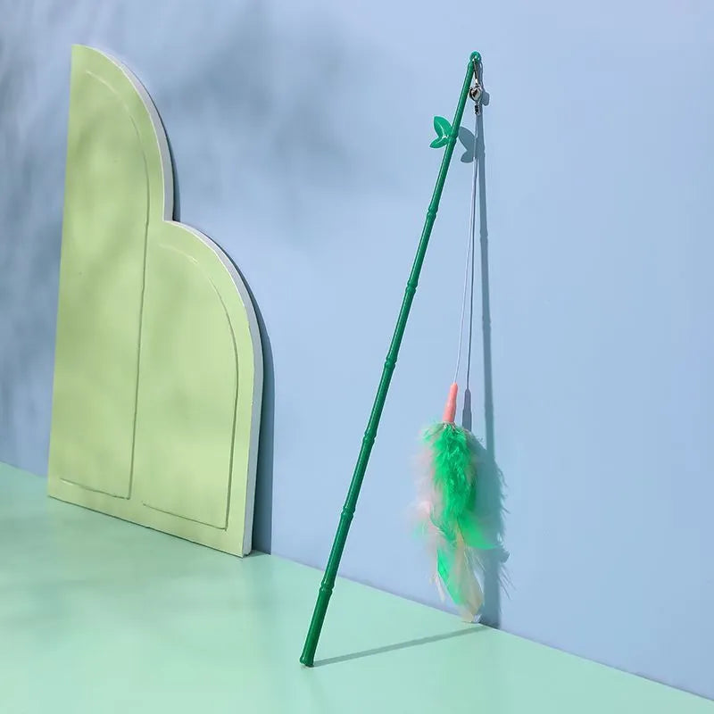 Green interactive cat feather wand toy with bells and durable construction for playful stimulation