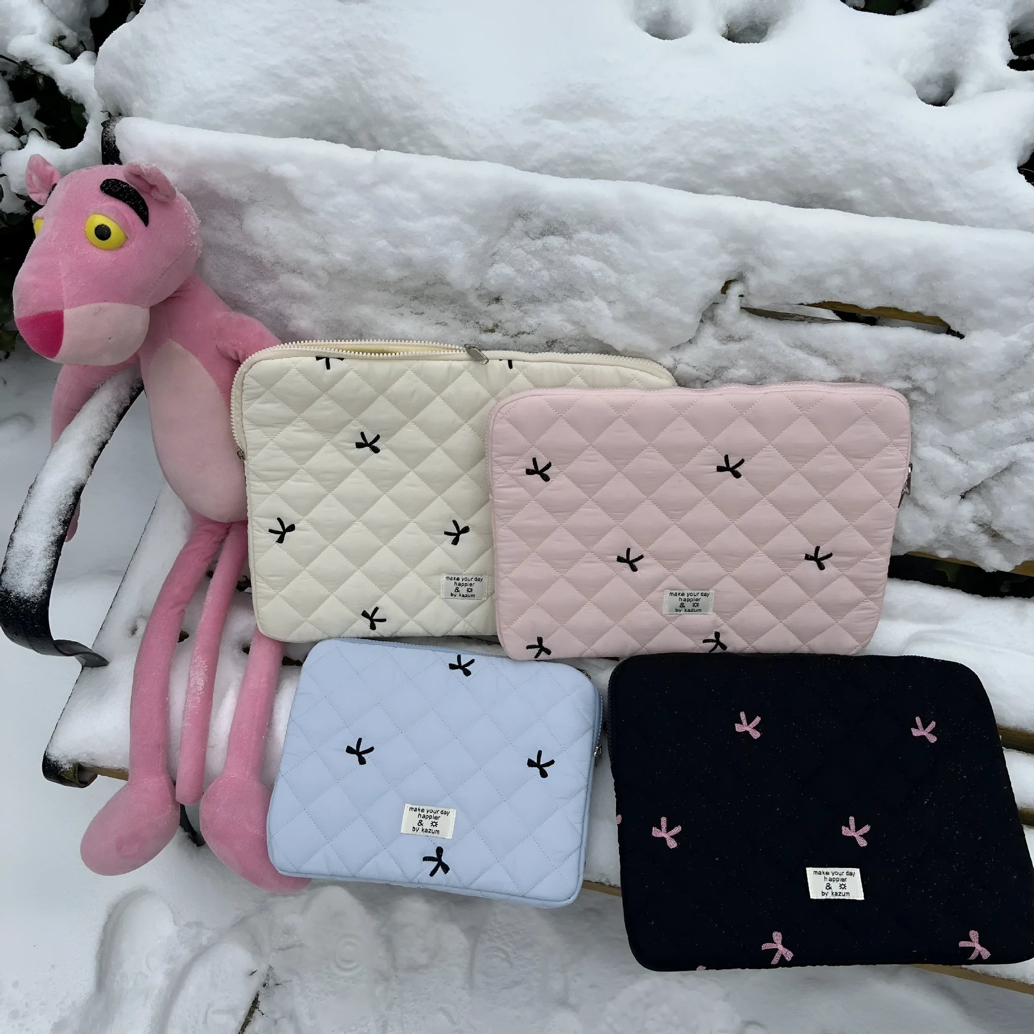 White laptop storage bag with rhombus embroidery and bow design in nylon fabric