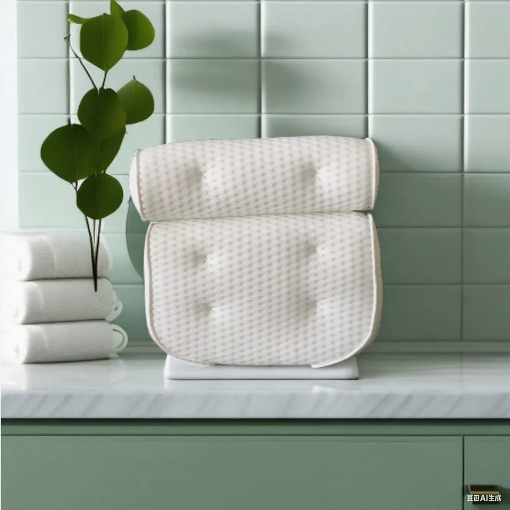 White 4D mesh bathtub pillow with suction cups on a clean bathtub surface.