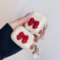 Beige red bow shell coloured TPU clamshell case cover for Apple AirPods charging case.