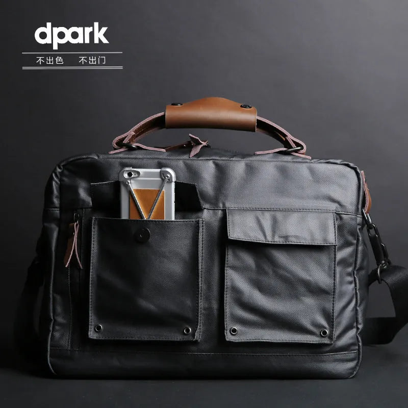 Dpark single shoulder sling laptop bag in black, open showing padded interior for a 15-inch laptop.