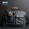 Dpark single shoulder sling laptop bag in black, open showing padded interior for a 15-inch laptop.