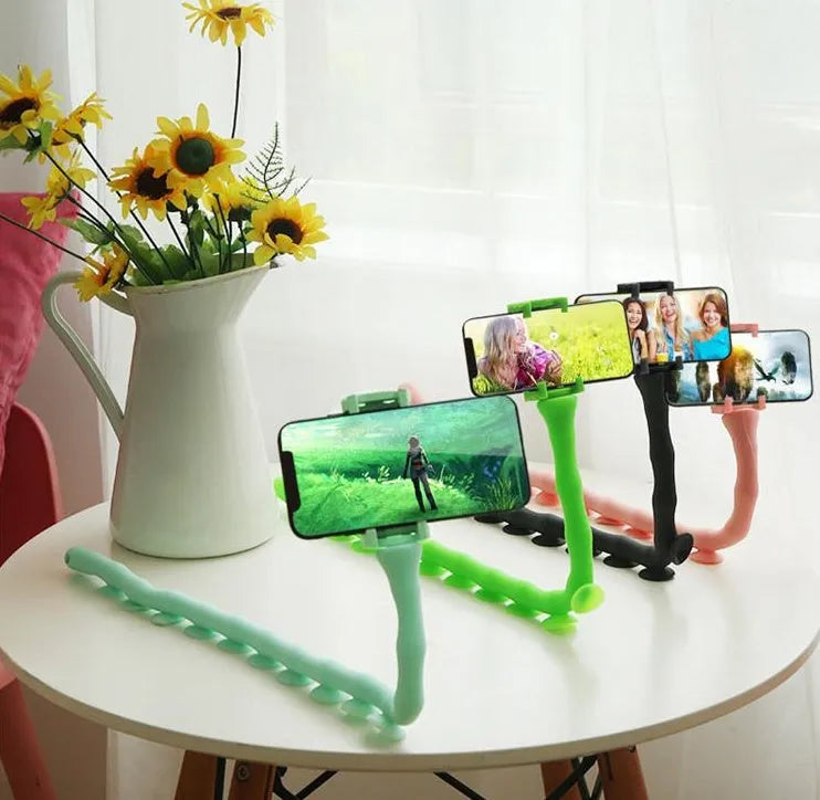 Black flexible rubber phone holder with long 62cm arm and suction cup, holding a mobile phone at an angle.