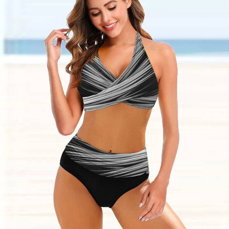 Ladies high-waisted striped tie-dye bikini set with backless briefs on a mannequin.