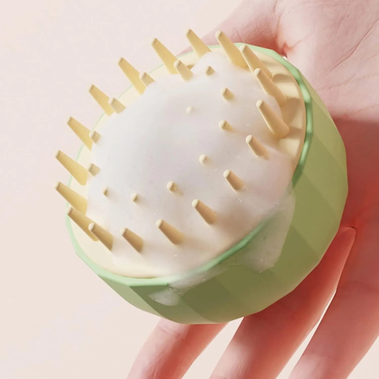 Green pet bath massage brush with drainage holes for dogs and cats during shampooing