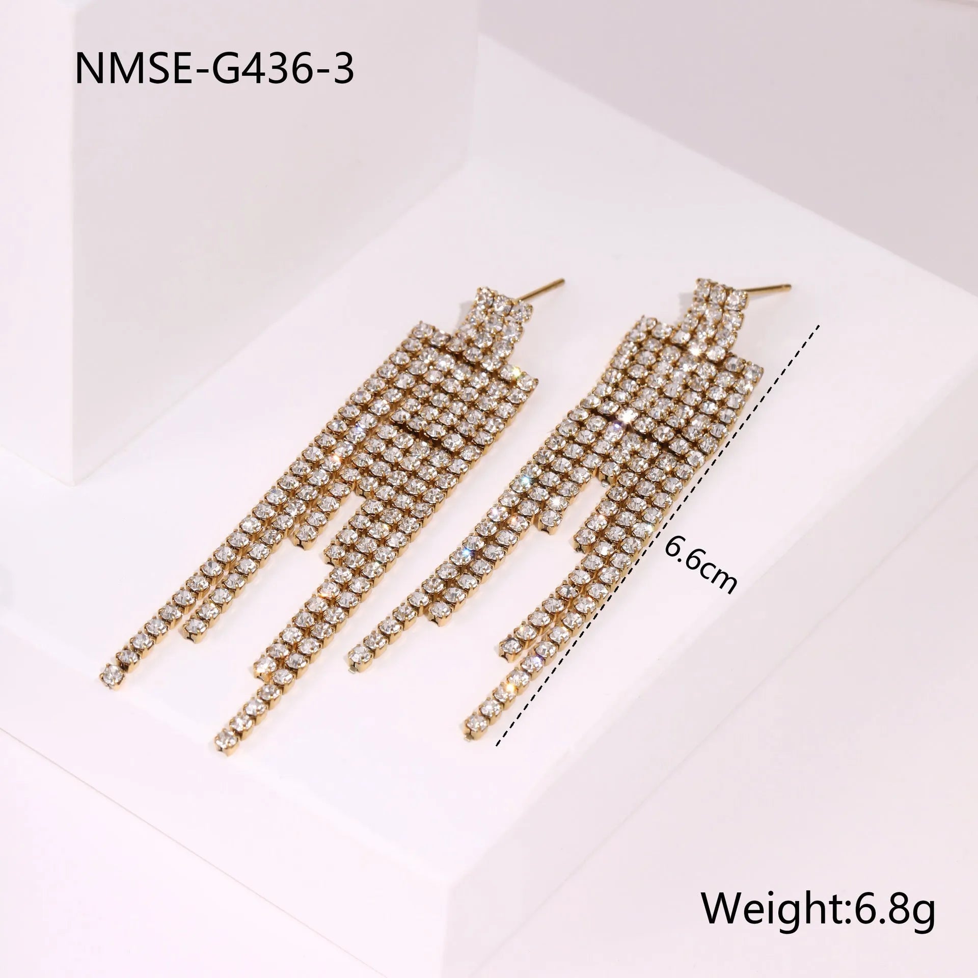 Pair of 18K gold plated stainless steel earrings featuring heart and star shapes with diamond tassels