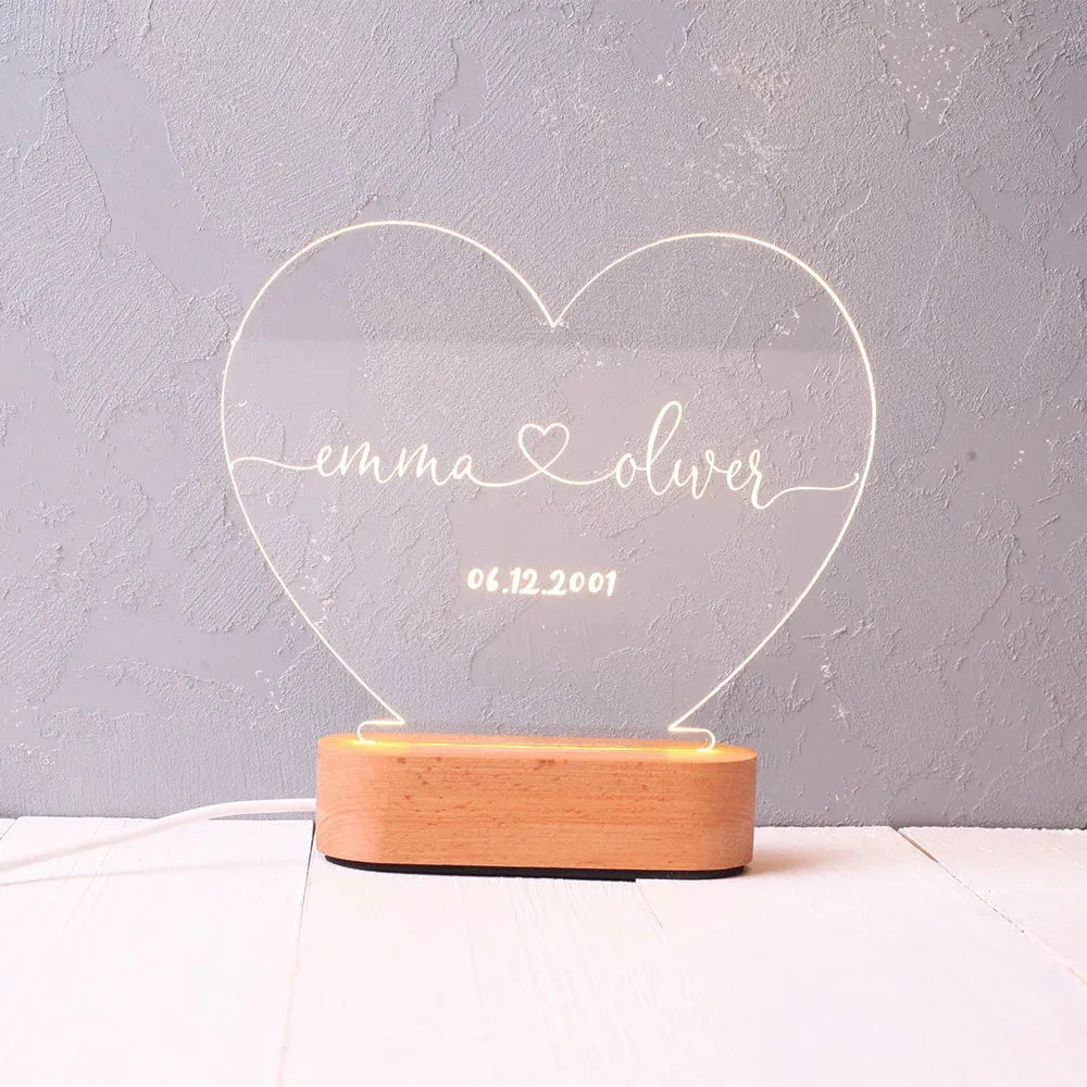 Custom acrylic LED night light displaying personalised names and date text